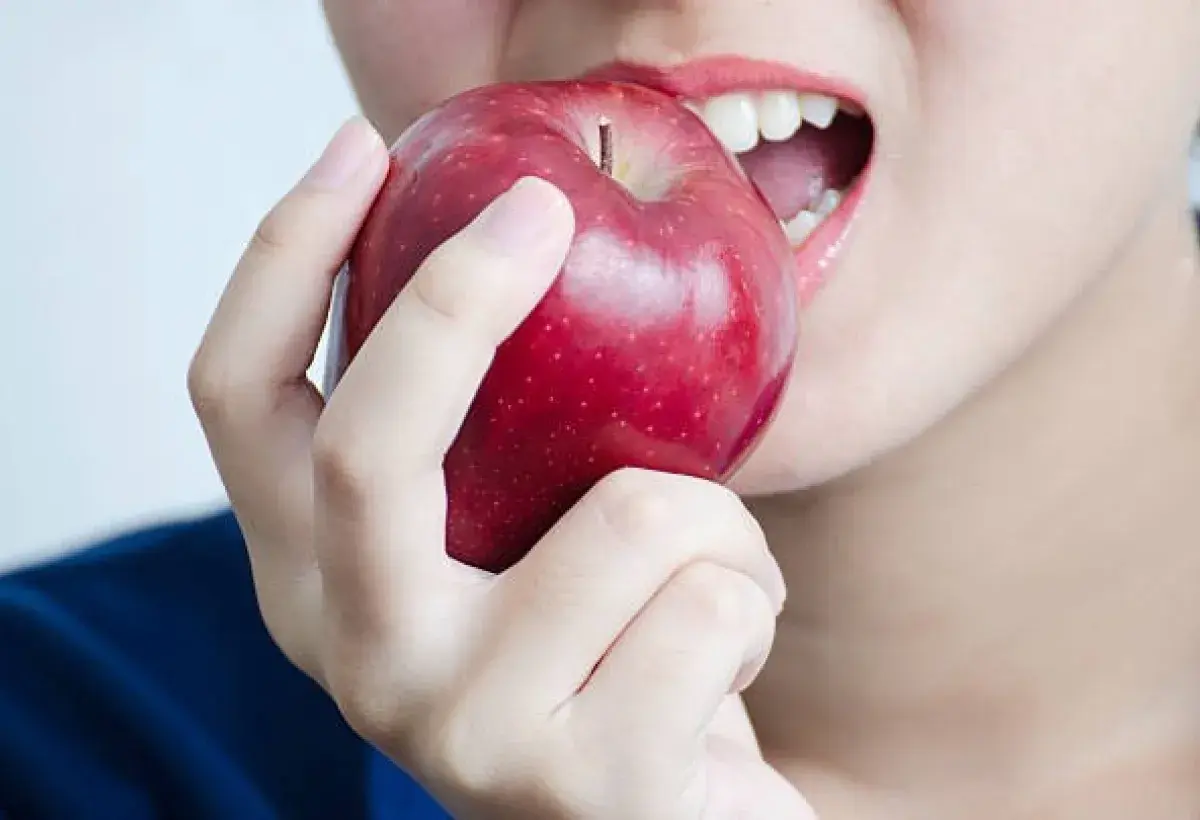 Teeth Biting Into Fresh Apple
