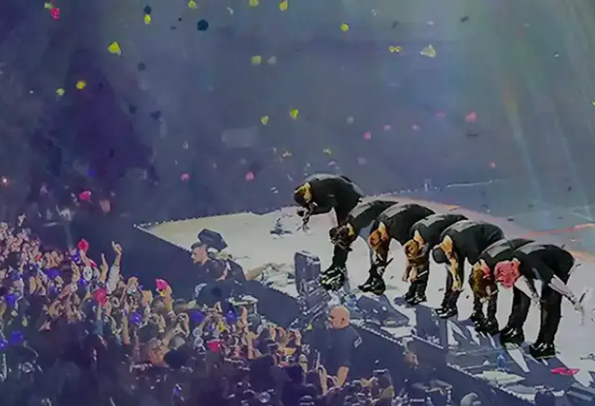 K-pop idols bowing to audience after global concert performance