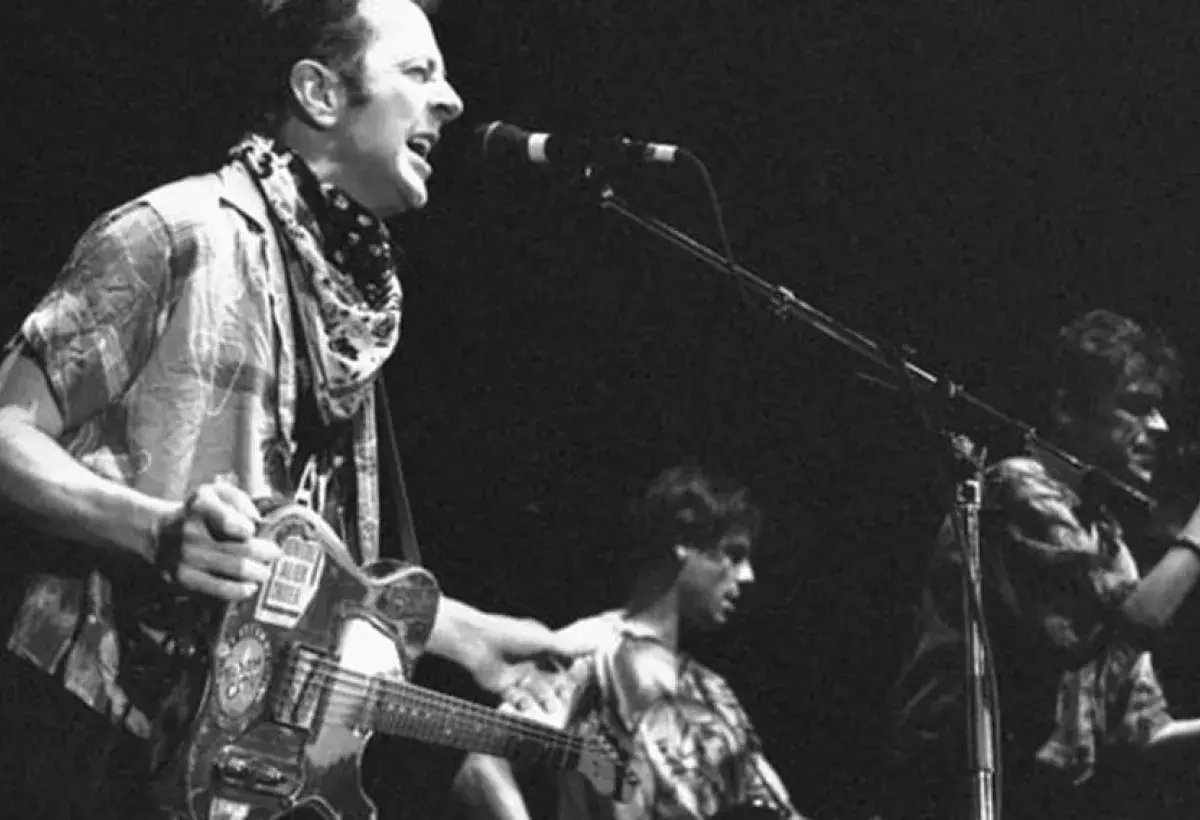 Joe Strummer performing with intensity and presence