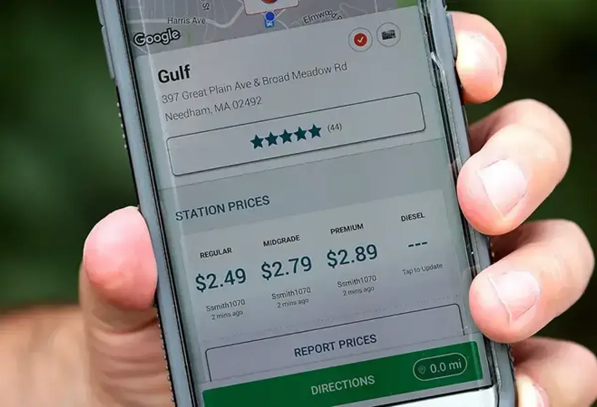 Driver using an app to find the best gas prices.