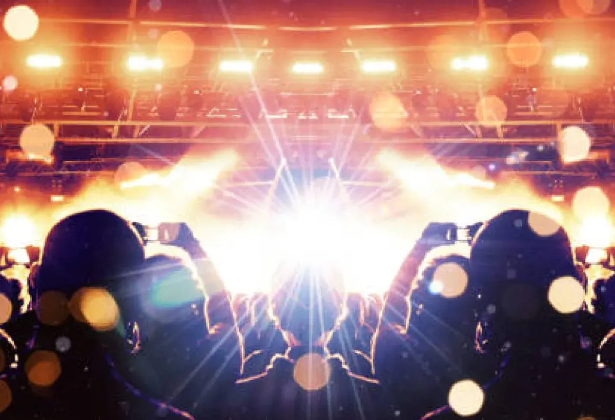 Audience waiting for a live performance with dramatic lighting