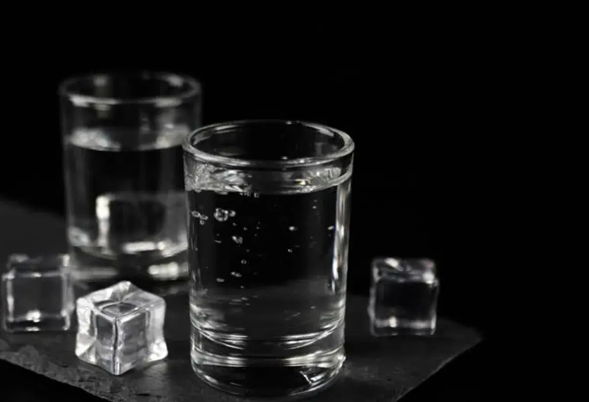 Crystal-clear vodka in a shot glass