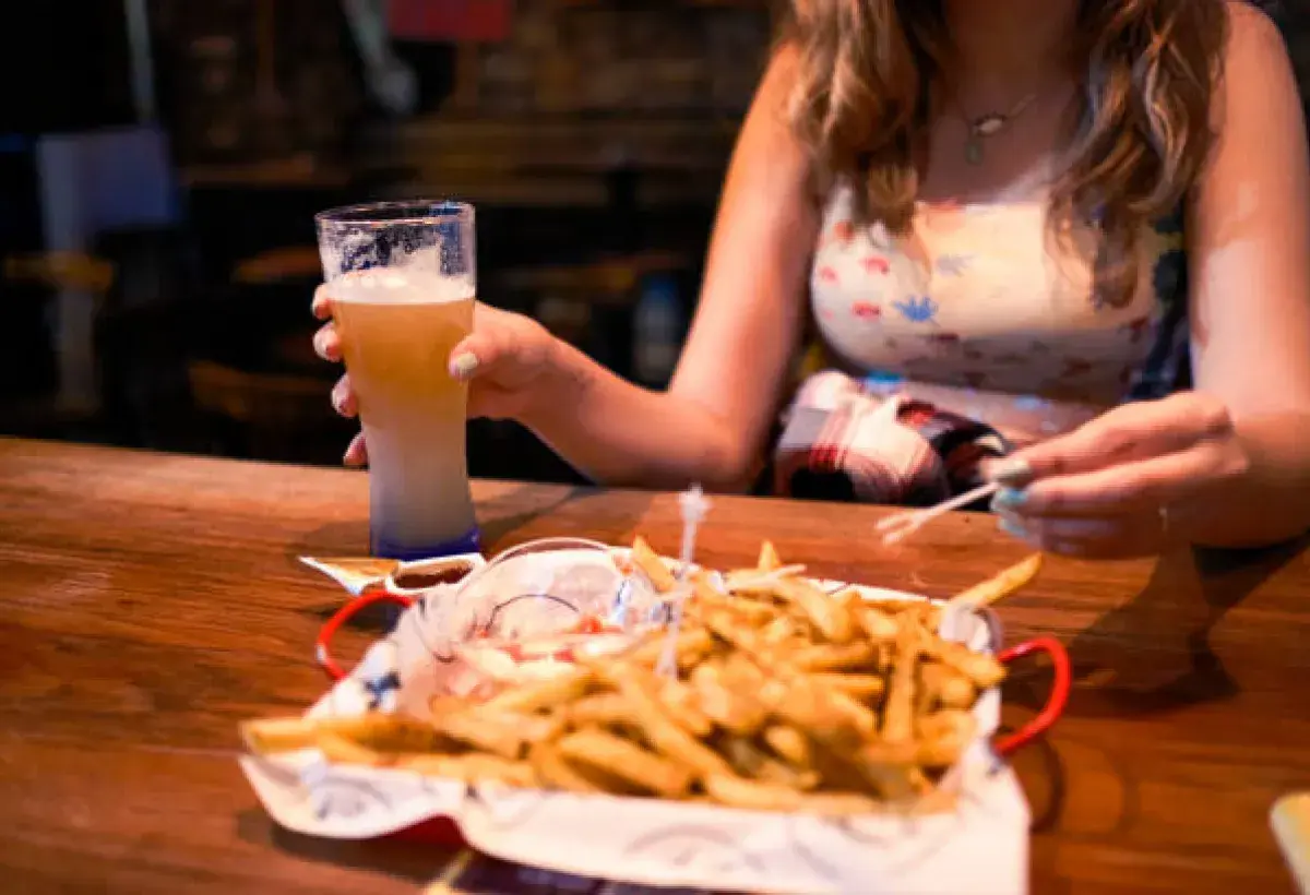 Typical American fast food meal featuring oversized drink and fries