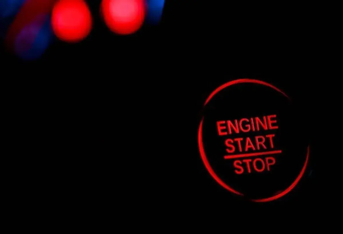 Car at red light with engine turned off to save fuel