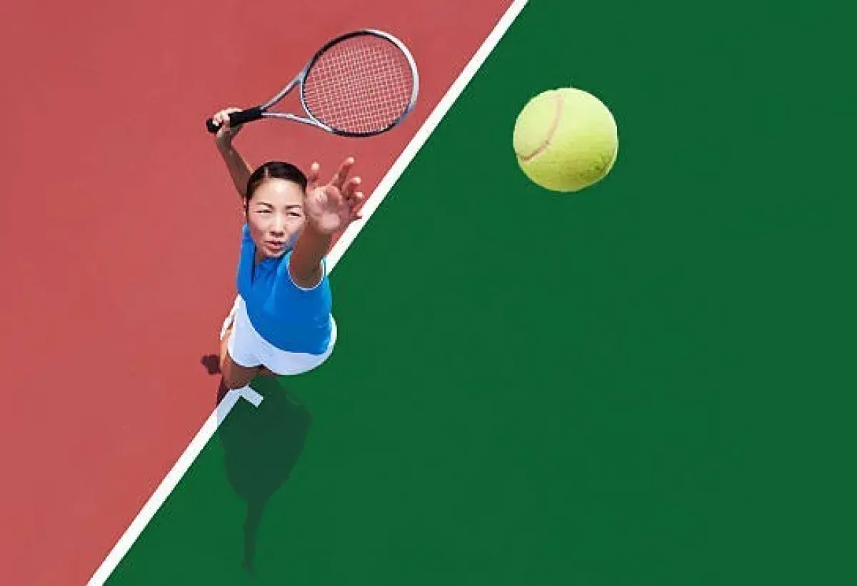 Tennis athlete serving ball on center court during major Grand Slam