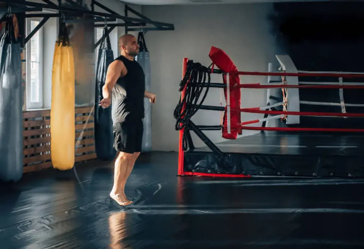 Boxer training in a gym while jumping rope