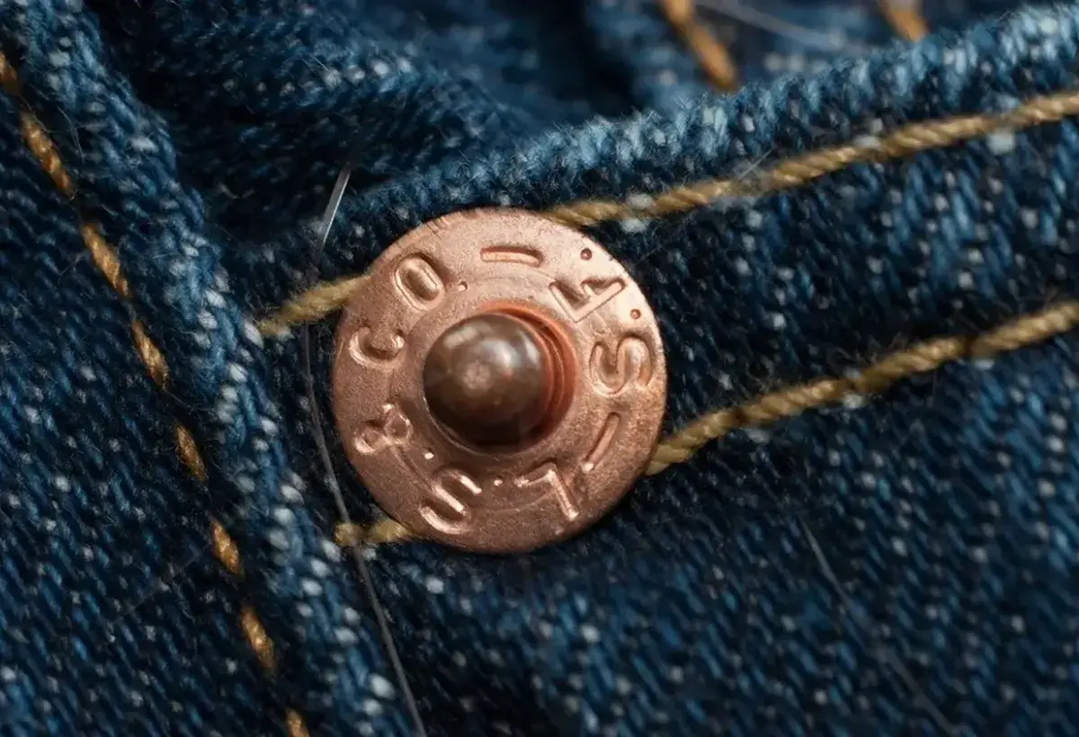 Iconic copper rivets reinforcing Levi’s jeans design