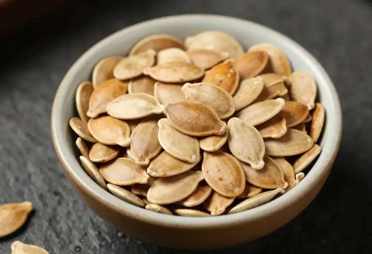 pumpkin seeds in small ceramic bowl