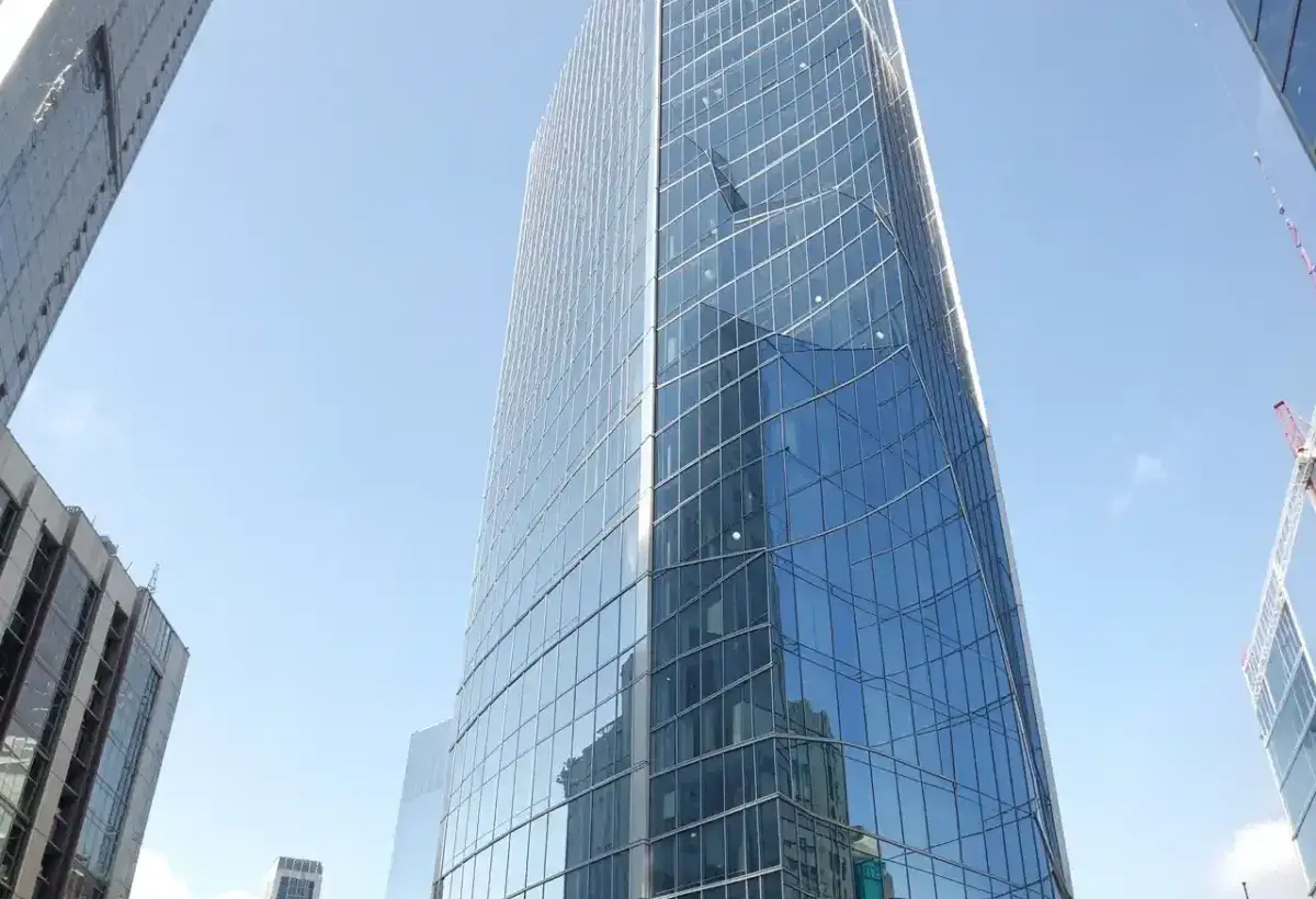 Skyscraper covered in large architectural glass panels