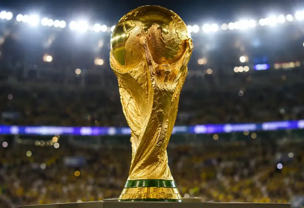 FIFA World Cup Trophy under stadium lights