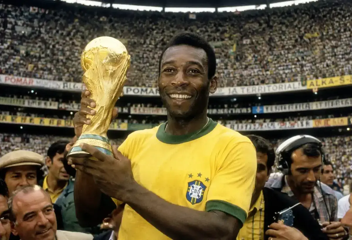 Pelé celebrating a World Cup victory with Brazil