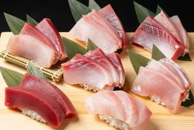 Assorted tuna cuts from otoro to akami displayed for sushi preparation
