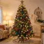 Cozy living room with a beautifully decorated Christmas tree full of shiny ornaments