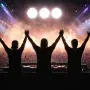Three DJs with arms raised before a massive festival crowd, with their iconic three-dot logo in the sky, symbolizing Swedish House Mafia's electrifying legacy.